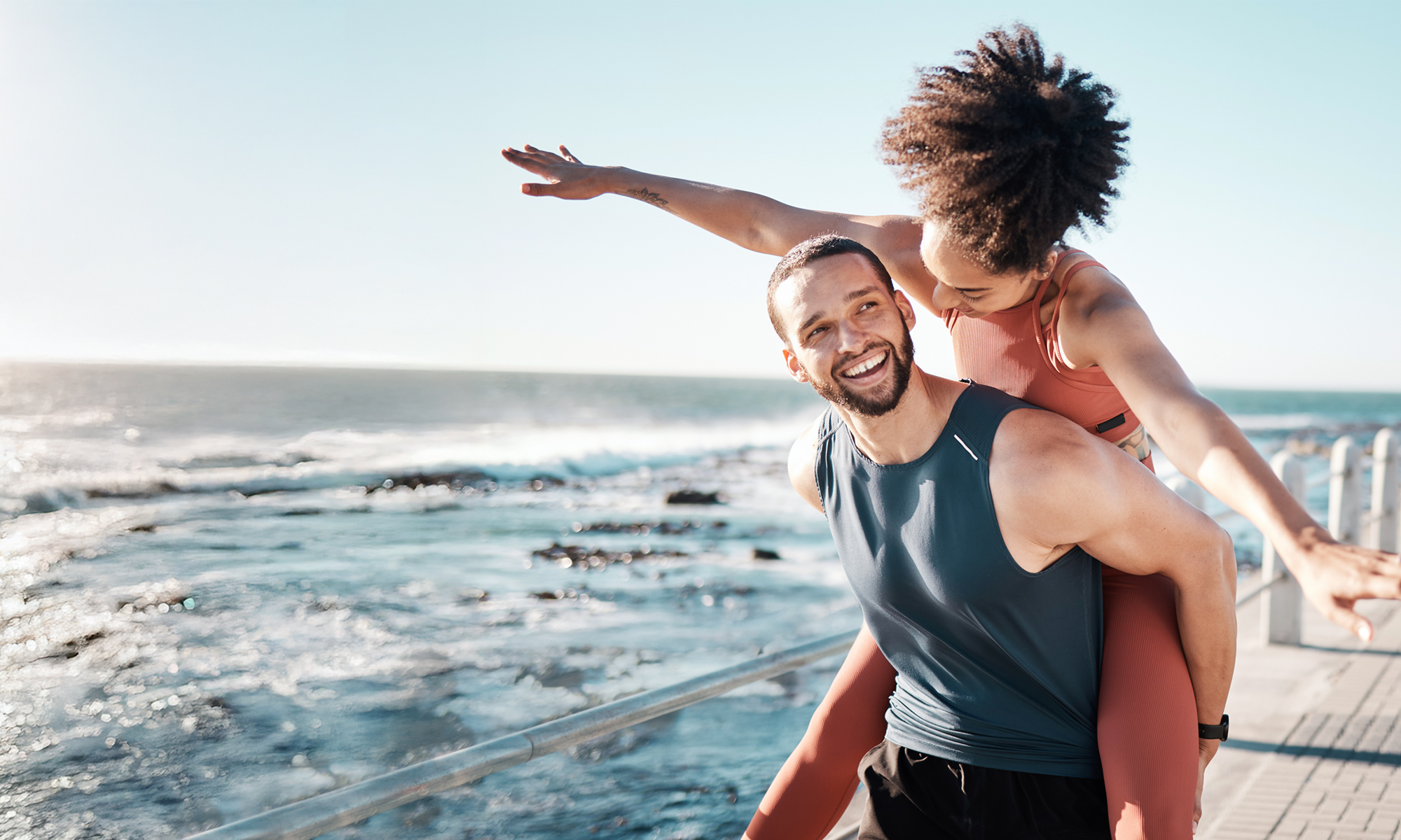 Couple laughs on beach