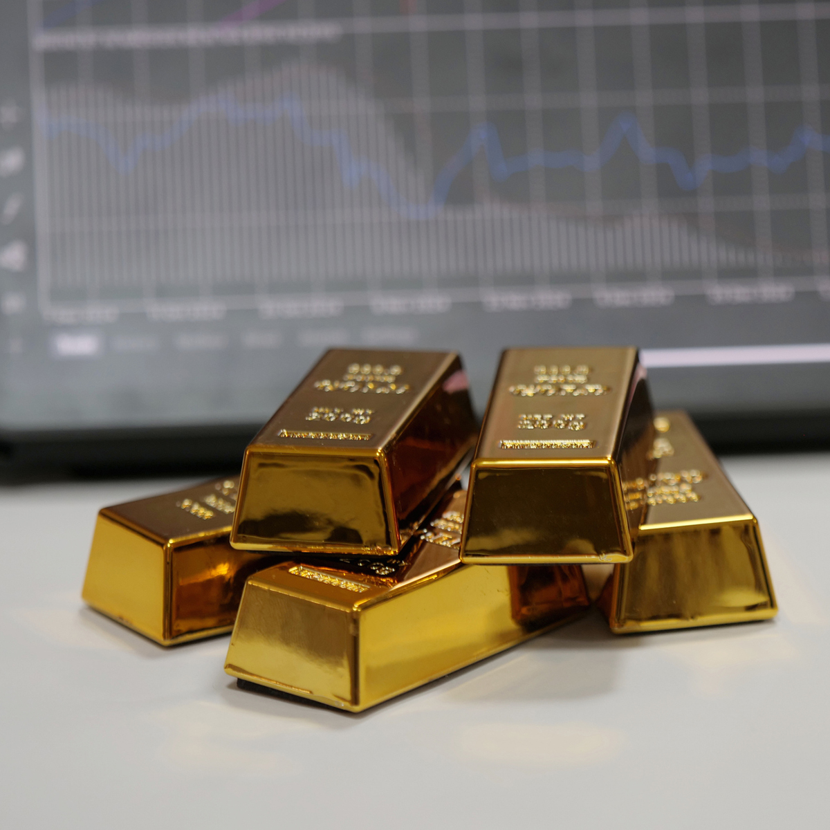 A stack of polished gold bars symbolizes wealth, stability, and value, reflecting their role in global finance and banking.