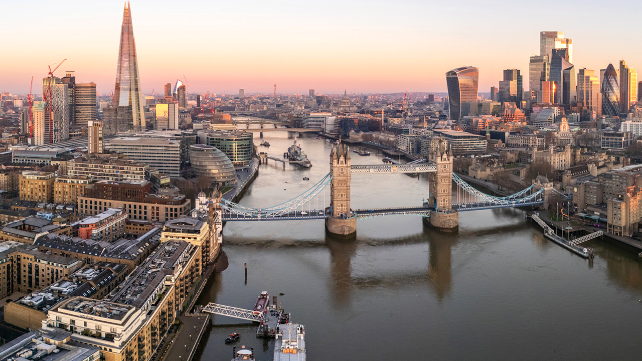 Aerial panorama of a bustling metropolis showcasing diverse boroughs, modern skyline, and expansive urban landscape.