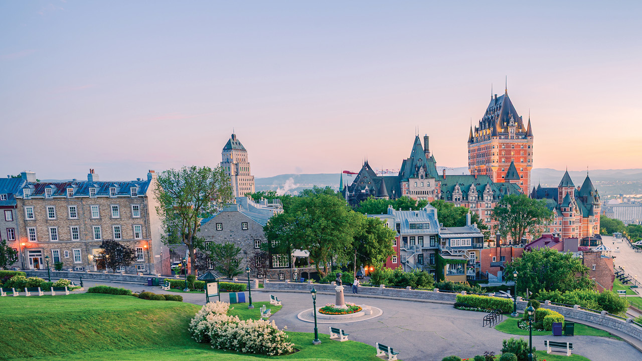 Historic downtown square by parliament buildings, presenting a formal urban cityscape for sightseeing and photography.