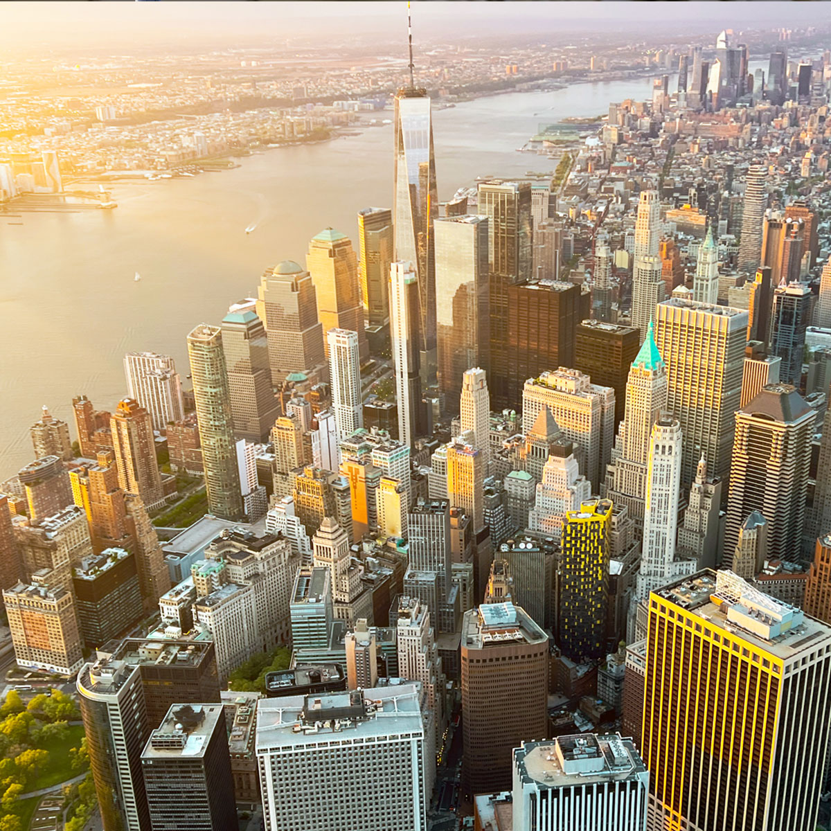 An aerial view showcases a modern cityscape with towering skyscrapers and intricate architecture in a bustling downtown.