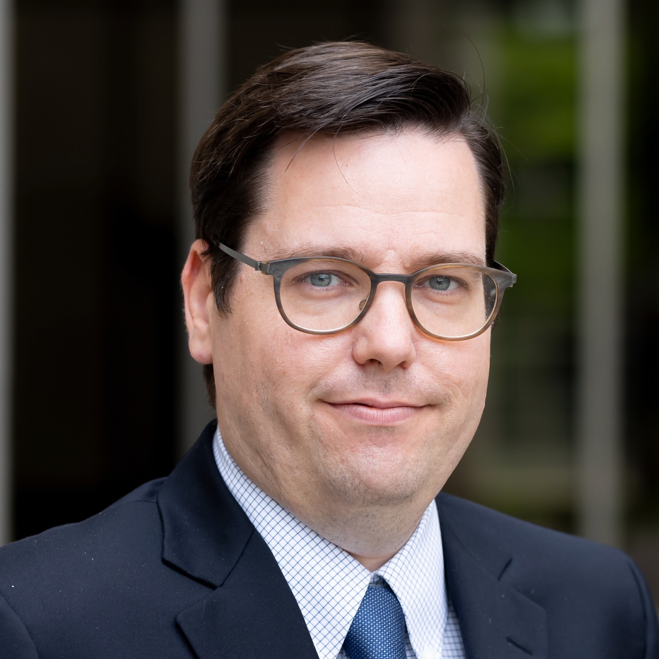 This is a professional head shot image of Alexandre Biography.