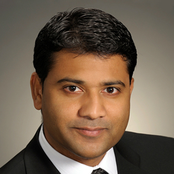 This is a professional head shot image of Thiru Roshan.