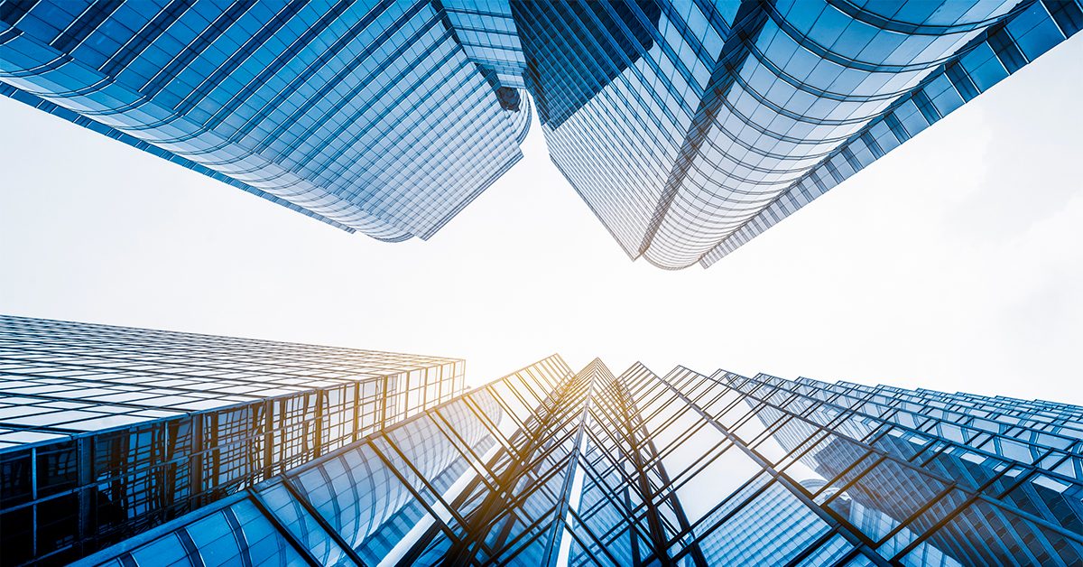 The modern glass skyscraper, reflecting the vibrant blue sky, stands as a symbol of dynamic city business architecture.