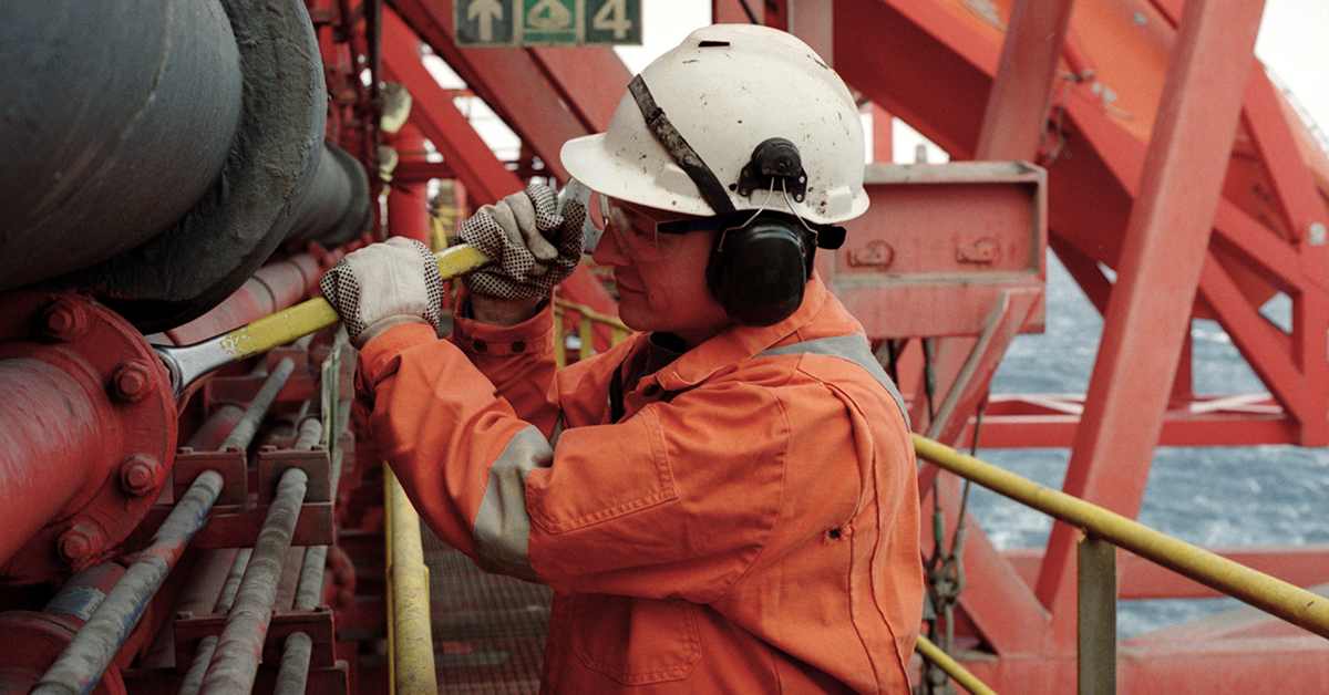 Men engaged in industrious work at a construction site, showcasing the integral roles of workers and engineers.