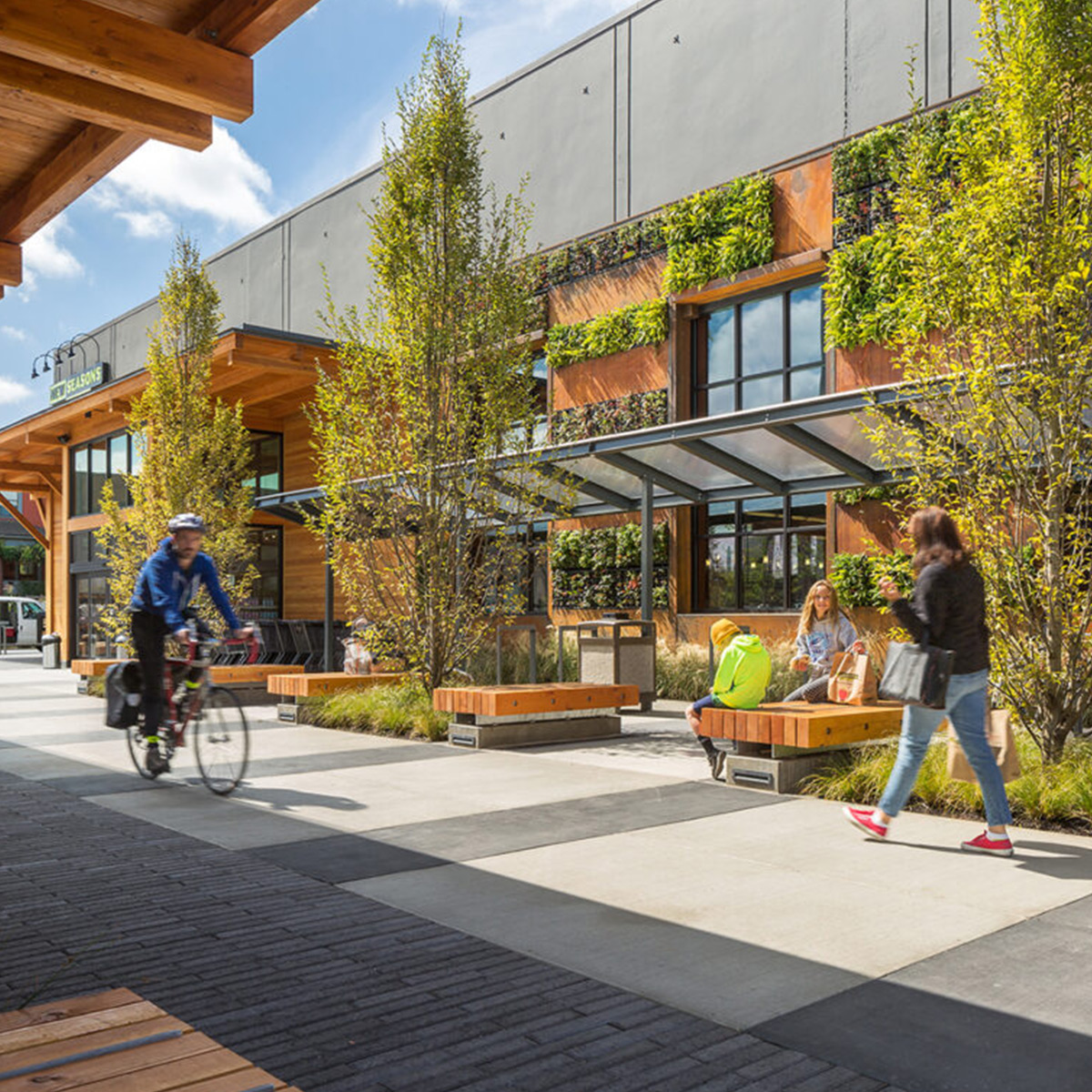 City professionals commute through urban streets, conducting daily operations amidst striking architectural landmarks and green parks.