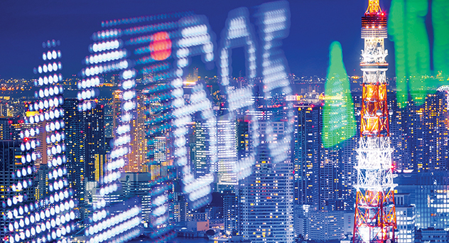 Abstract digital technology illuminates the night cityscape, creating a blue backdrop for business data on computer screens.
