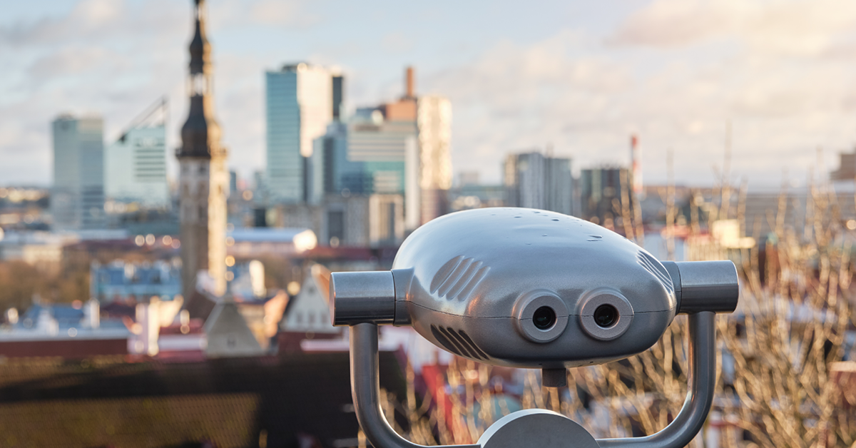 Panoramic view of dynamic cityscape, with stationary binocular devices available for tourist viewing