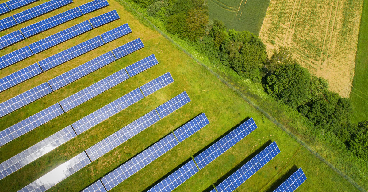 Ariel image of a solar farm in a green field