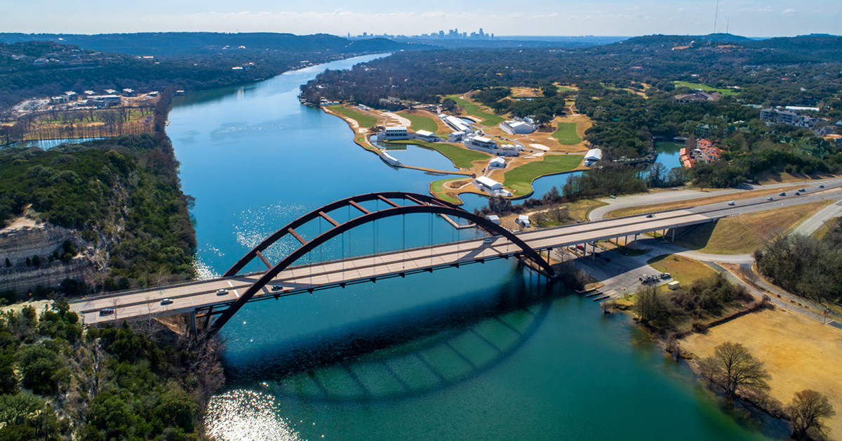 bridge over river with taffic on it.