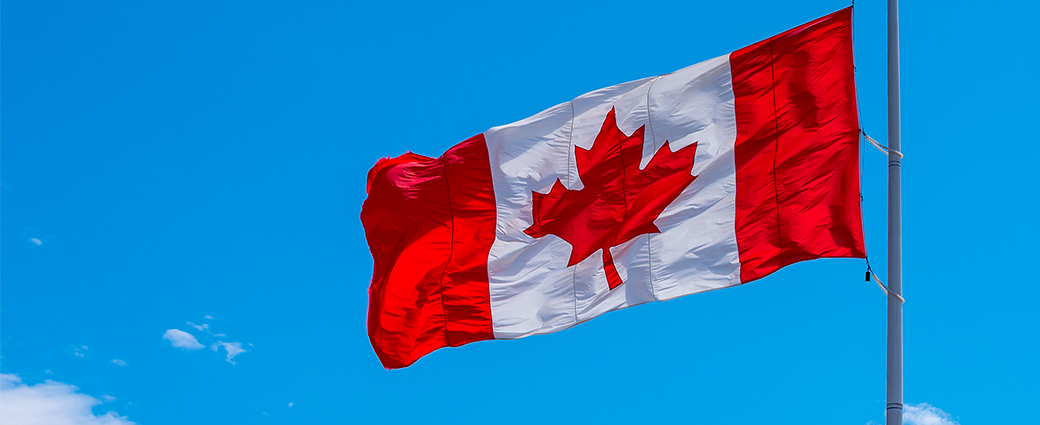The Canadian flag, a national symbol of patriotism, proudly displays its red, white, and blue banner.