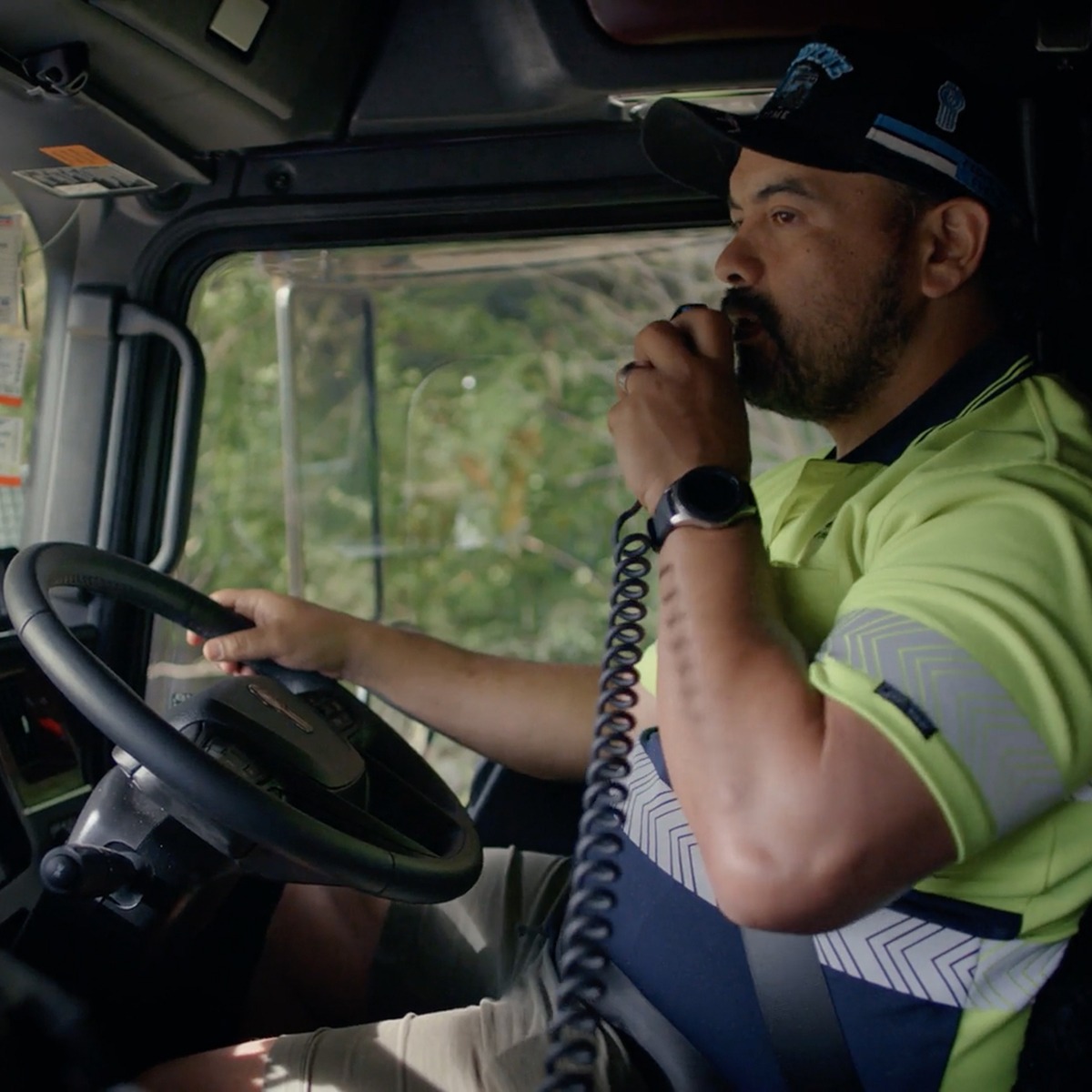 A male driver operates a modern vehicle, showcasing professional driving skills in a well-maintained automobile.
